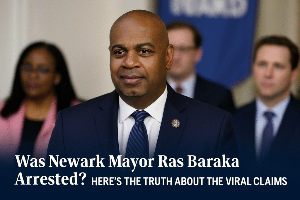 Newark Mayor Ras Baraka in a navy suit with blurred colleagues in the background, overlaid with the headline "Was Newark Mayor Ras Baraka Arrested? Here’s the Truth About the Viral Claims"